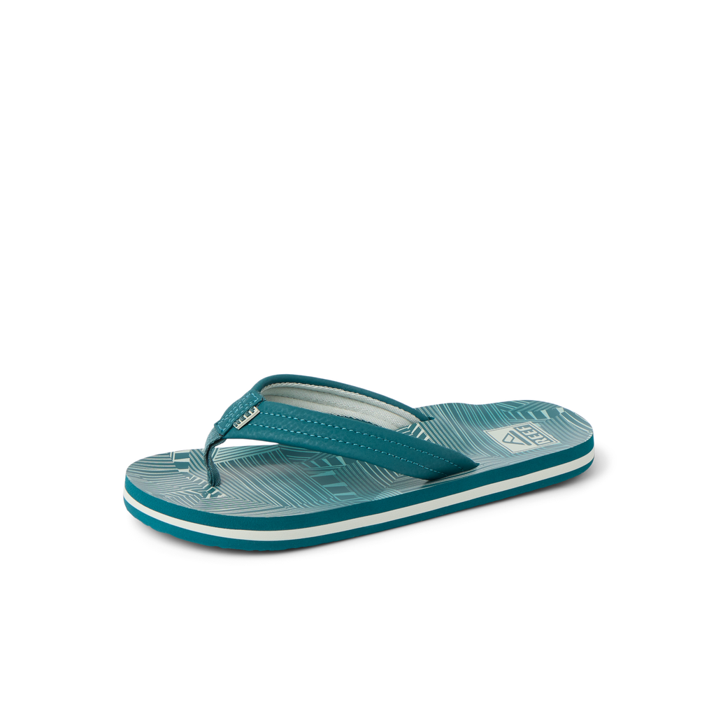 Kids Ahi teal striped flip flop facing right, close-up of footbed and straps with soft cushioning and arch support.